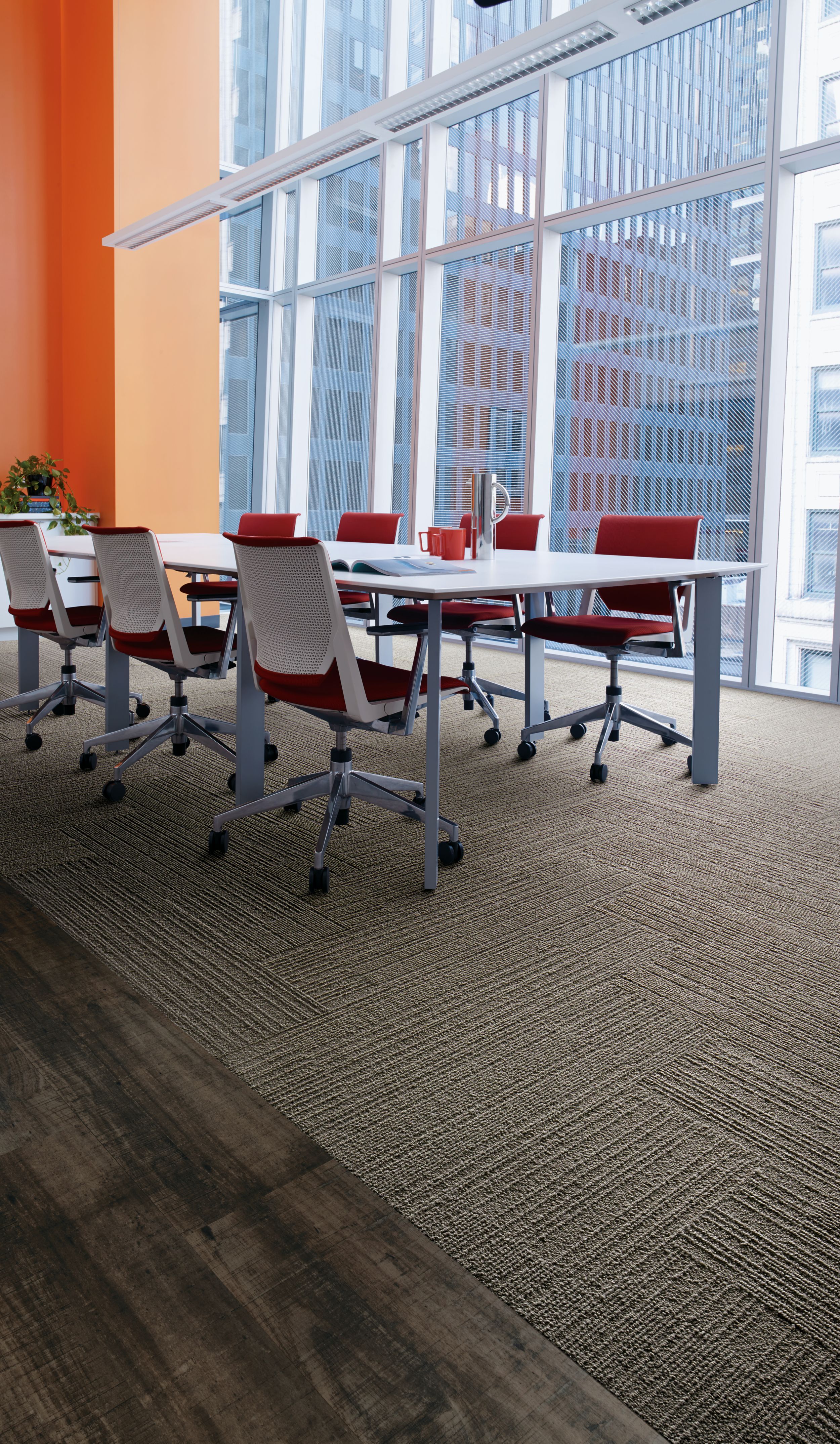 Interface On Line plank carpet tile in meeting room with orange wall and red chairs image number 8